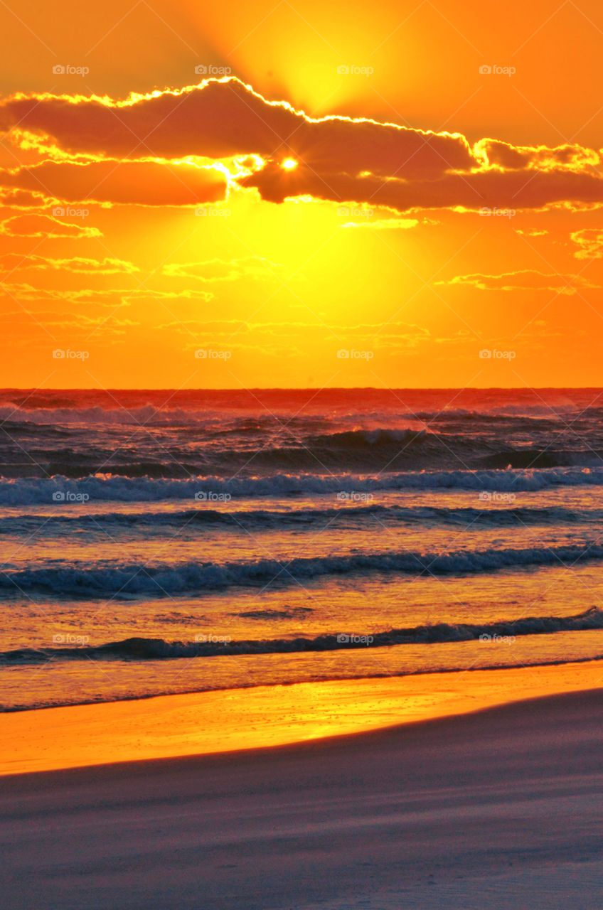 The bay had turned brilliant orange and the sky was streaked with the most beautiful sunset I had seen! Amber and tangerine beams were thrown into the dusty sky, its beautiful colors embracing the heavens gracefully!