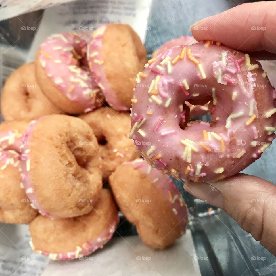 Mini donut treats. Pink icing and sprinkles. 