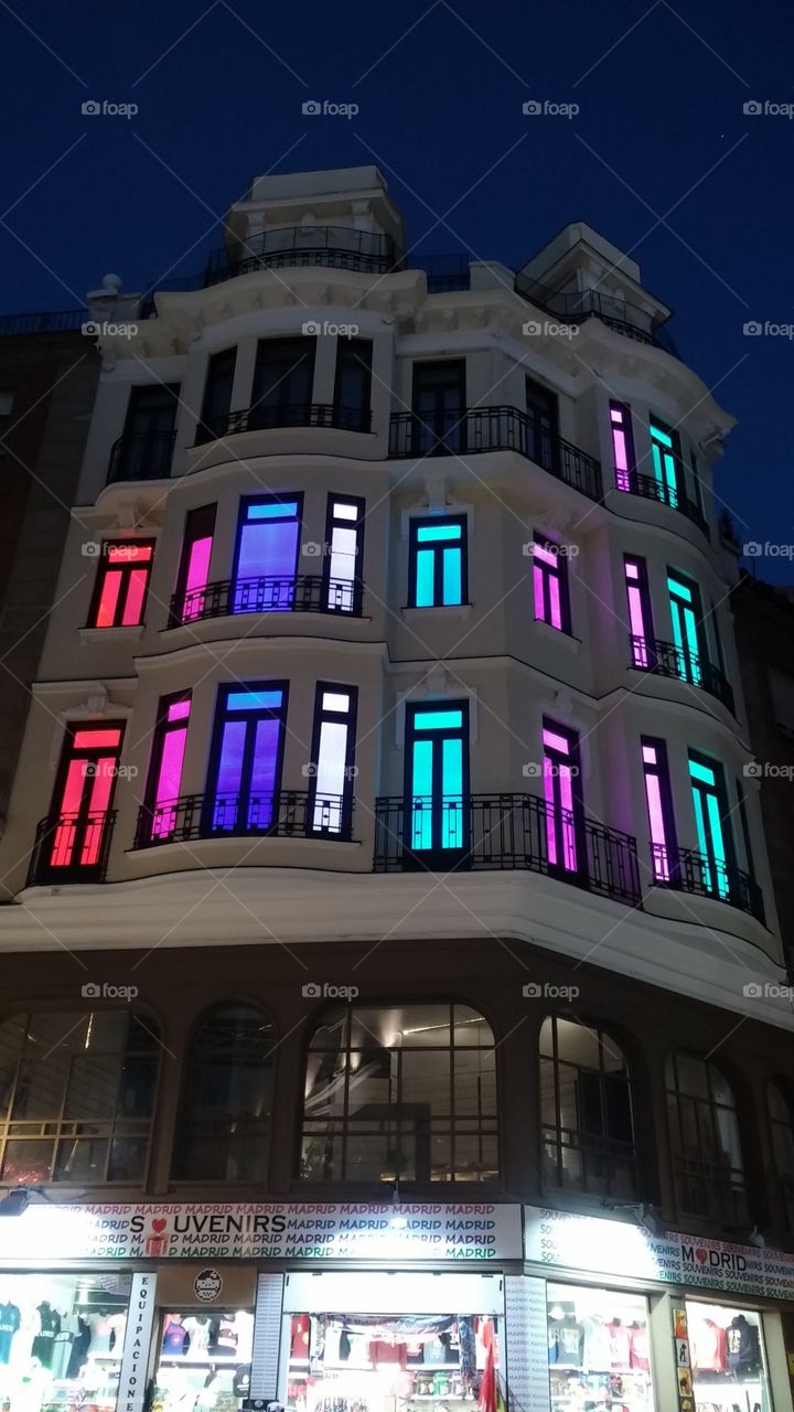 Colourful illuminated architecture in old Madrid, Spain