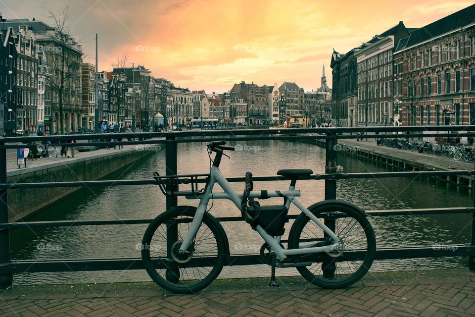 Bicycle on the bridge by canal at Amsterdam City, Netherlands