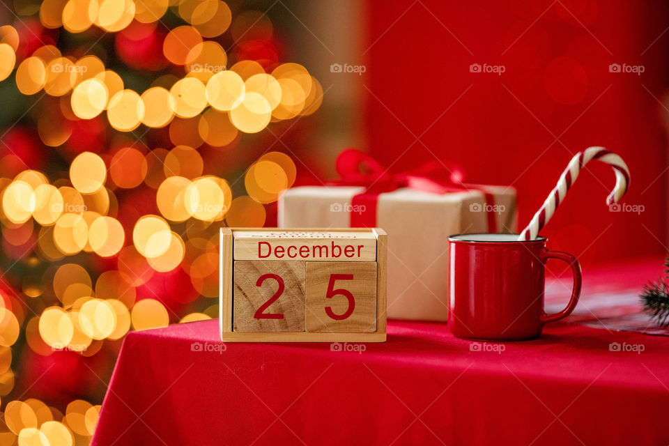 Christmas background with wooden block calendar with the date of December 25