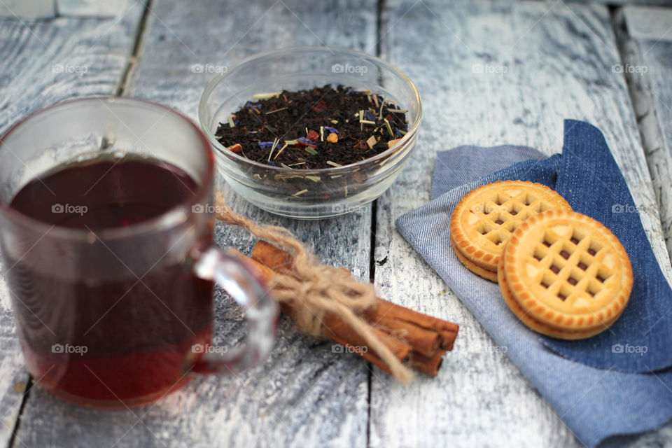 Tea tradition, tea, cup, mug, hot drink, cinnamon, cookies, napkin, jeans, denim napkin, fruit tea, flower tea, citrus, orange, lemon, rose petals, cookies, chocolate cookies, vanilla, vanilla sticks