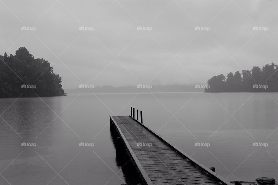 Misty moody lake New Zealand