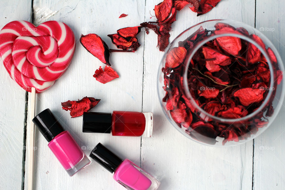 Beauty, health, spa and personal care: nail polish, flowers, rose petals, sweet