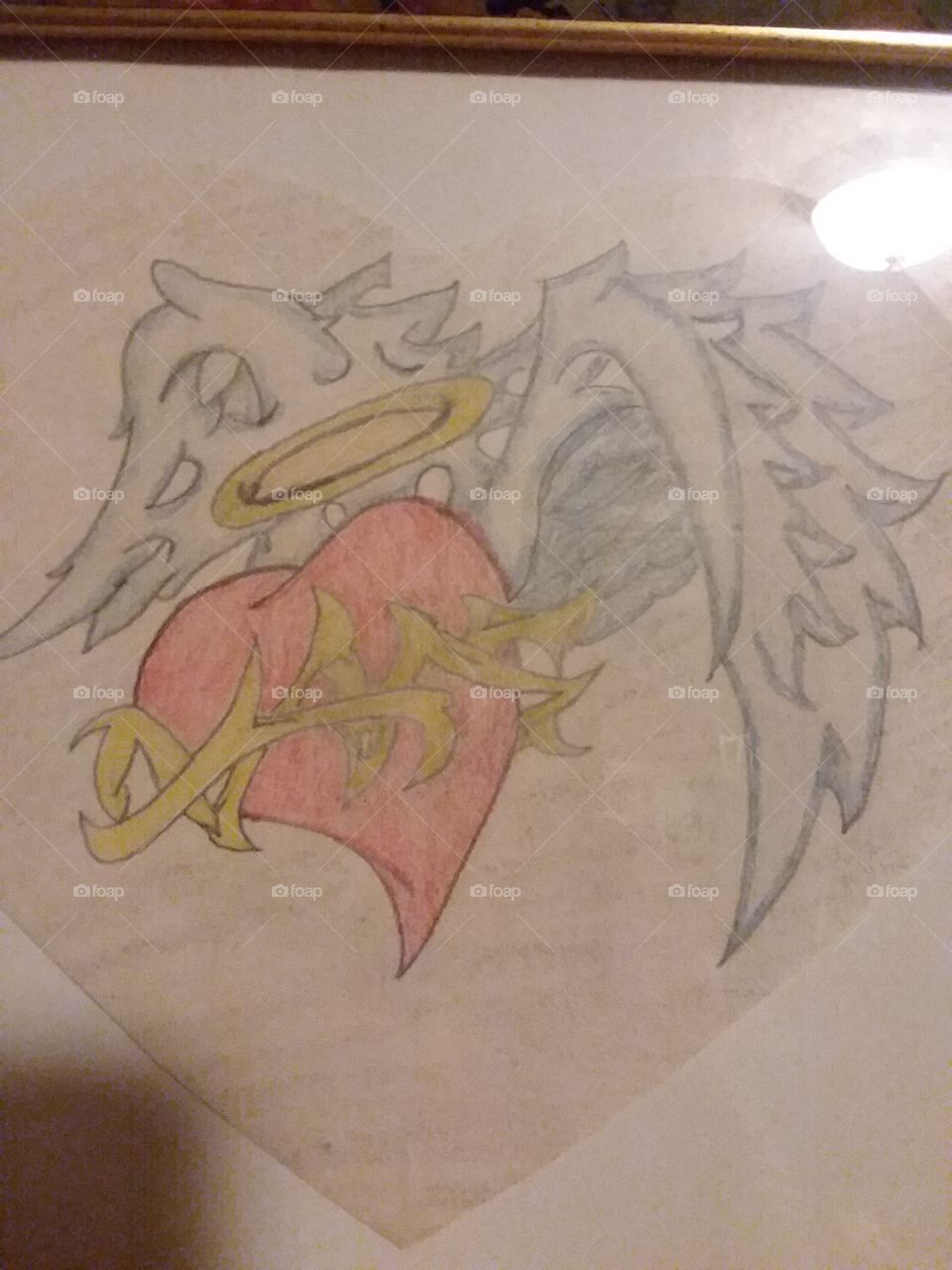 This is my hand drawn tatoo that represents ths death of my dad. the heart represents his heart, and the passing with the halo & wings and the barbed wire the pain it caused to my heart when he passed