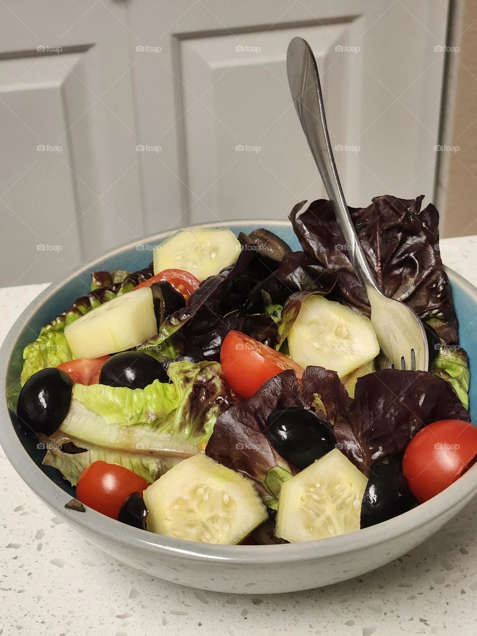 delicious healthy salad bowl with fork