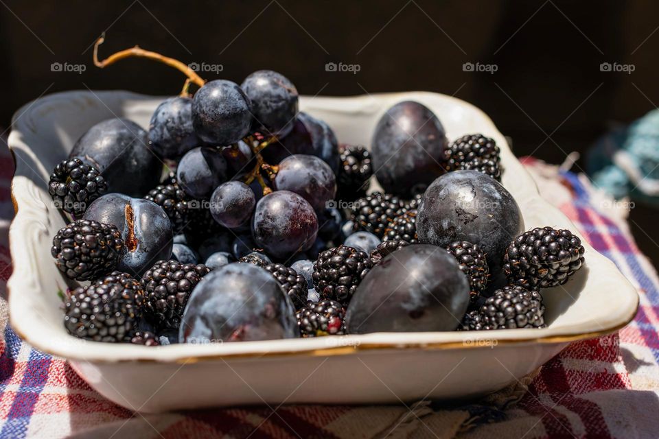 Fruit mix, summer fruit: grapes, blackberries, black currants, plums