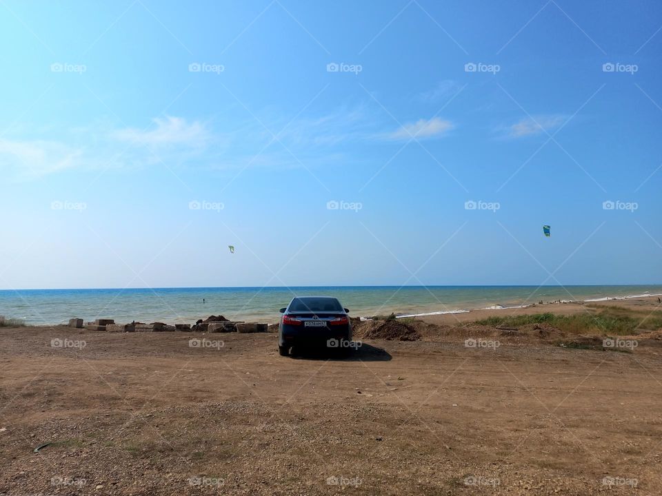 car on the seashore.