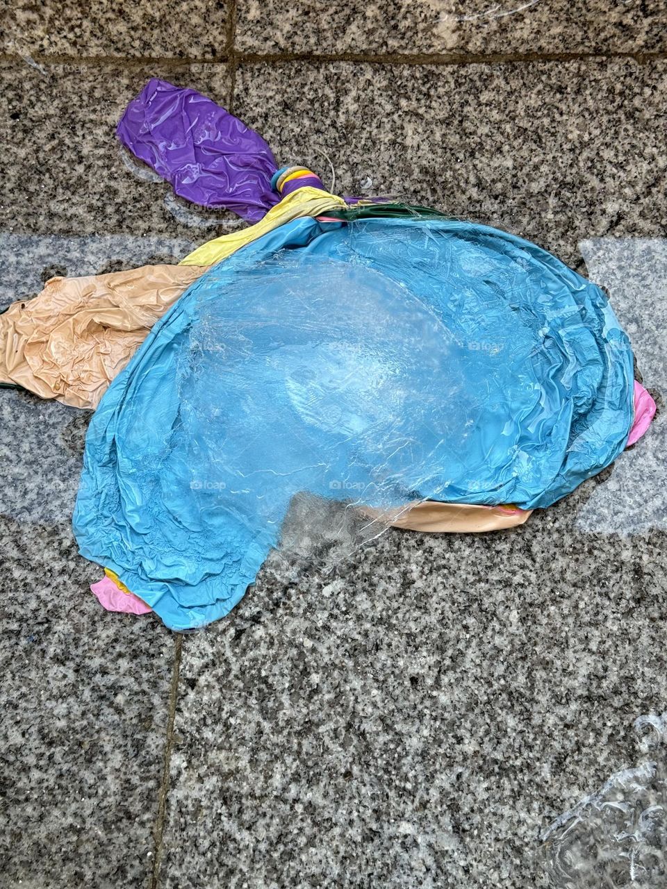 Balloons full of water that have burst and have a wonderful color