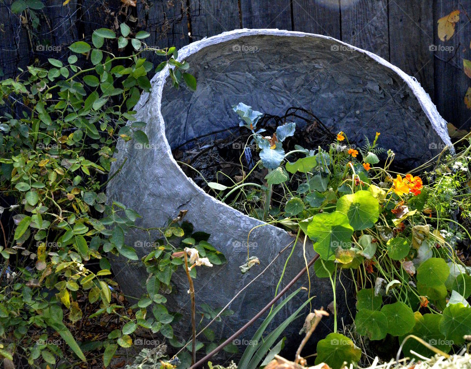 Made with leftover concrete, fabric strips and a workout ball wrapped in trash bags