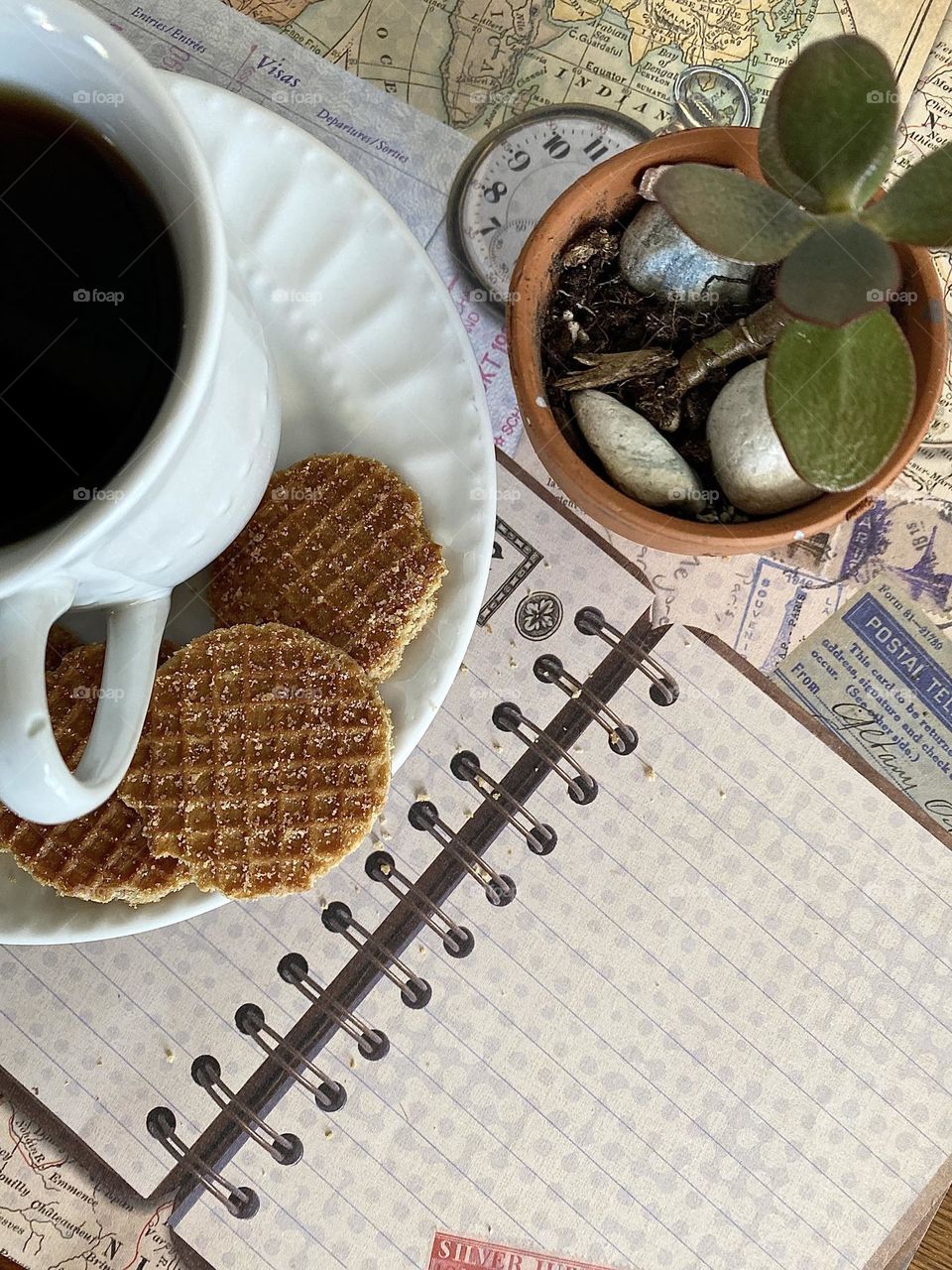 Top view of desktop with coffee and daily planner 