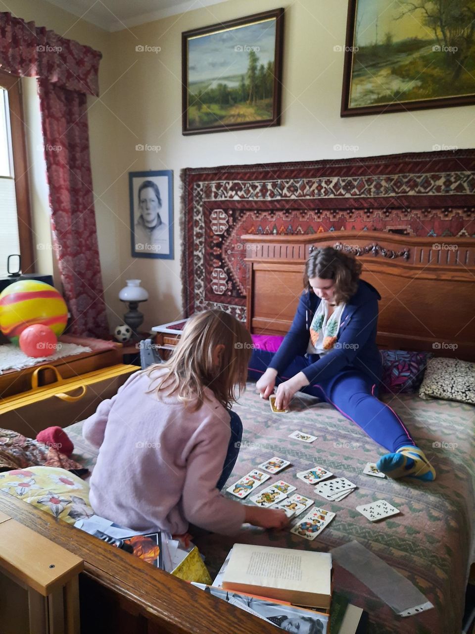 two girls playing cards