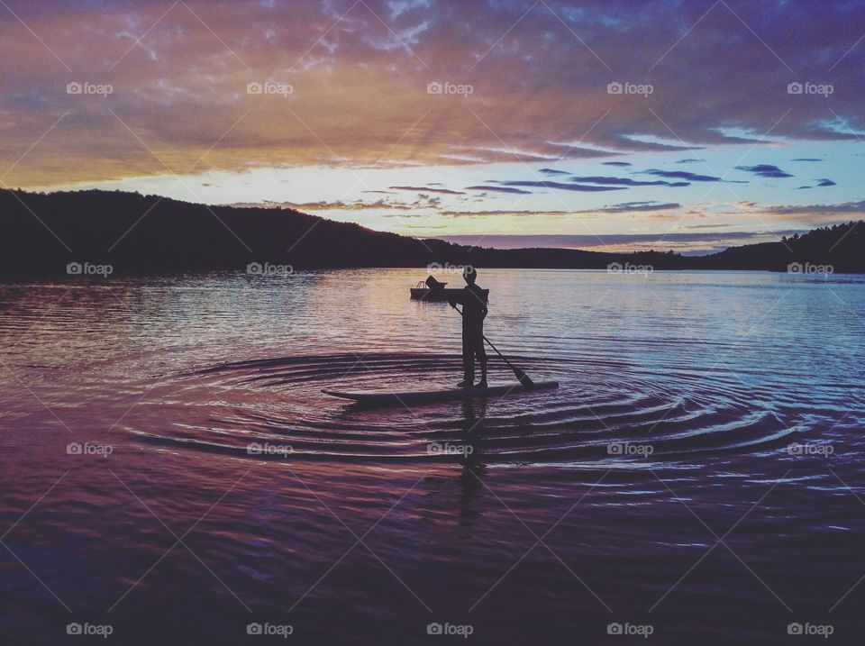 A boy on purple waters