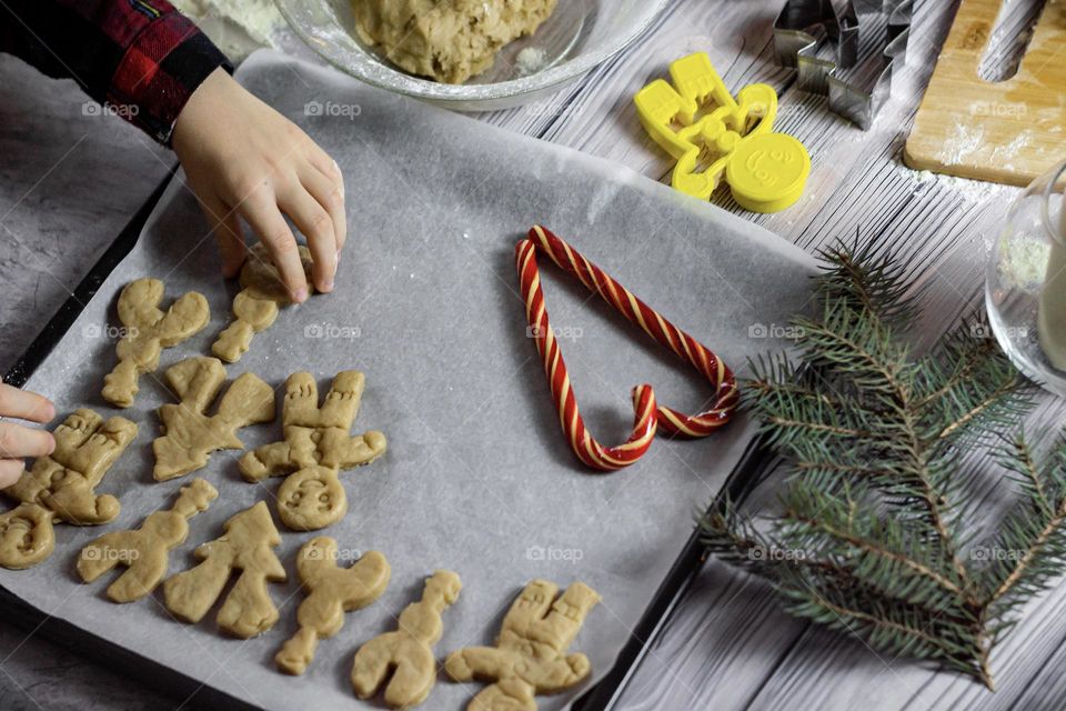 Cooking homemade Christmas cookies. Homemade product ginger muffins, hands in the frame