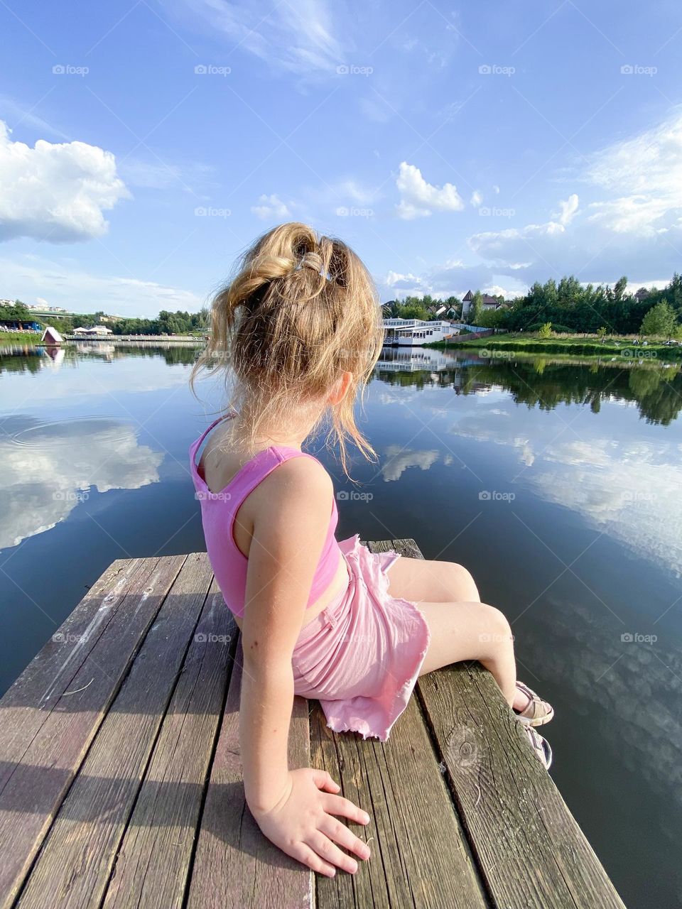 girl sitting on the bridge