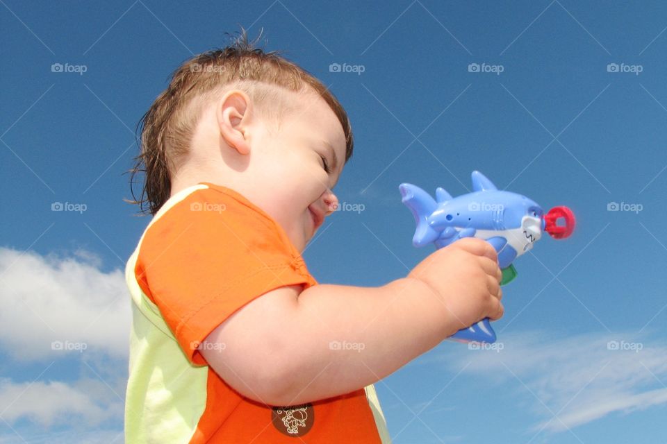 little boy playing a toy