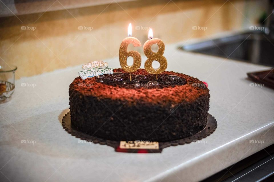 elderly people birthday cake and candle