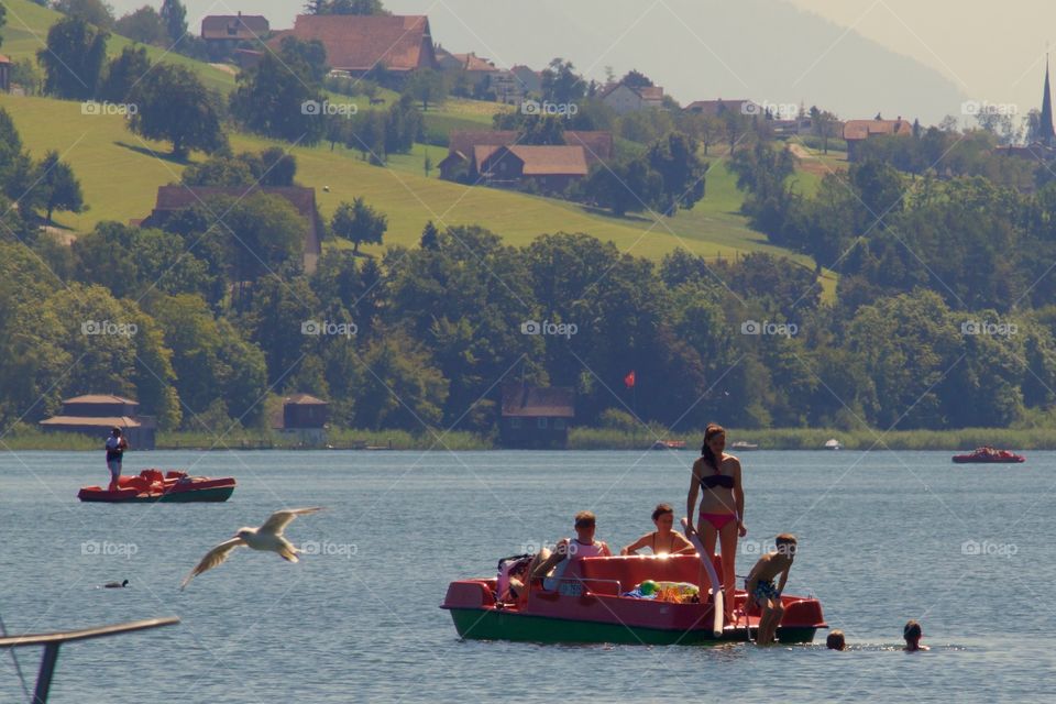 People Having Fun In Lake