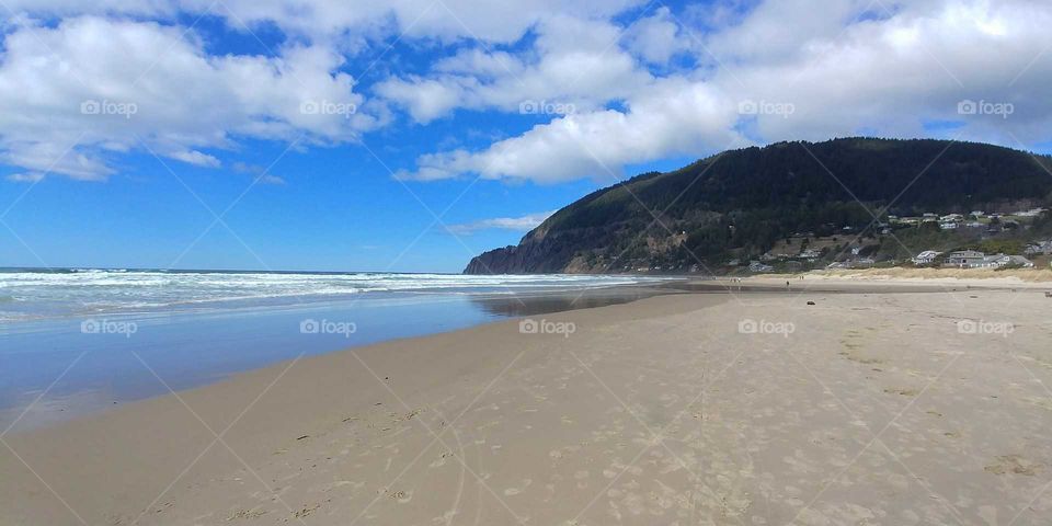 clouds playing above an Oregon coastline