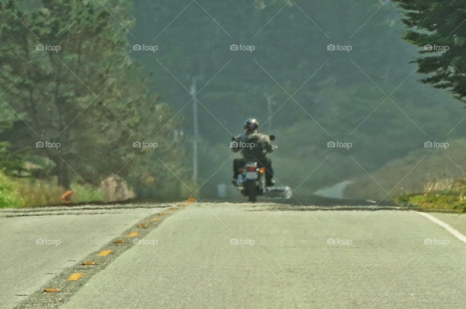 Lone Motorcycle Rider. Riding A Motorcycle On The California Coast
