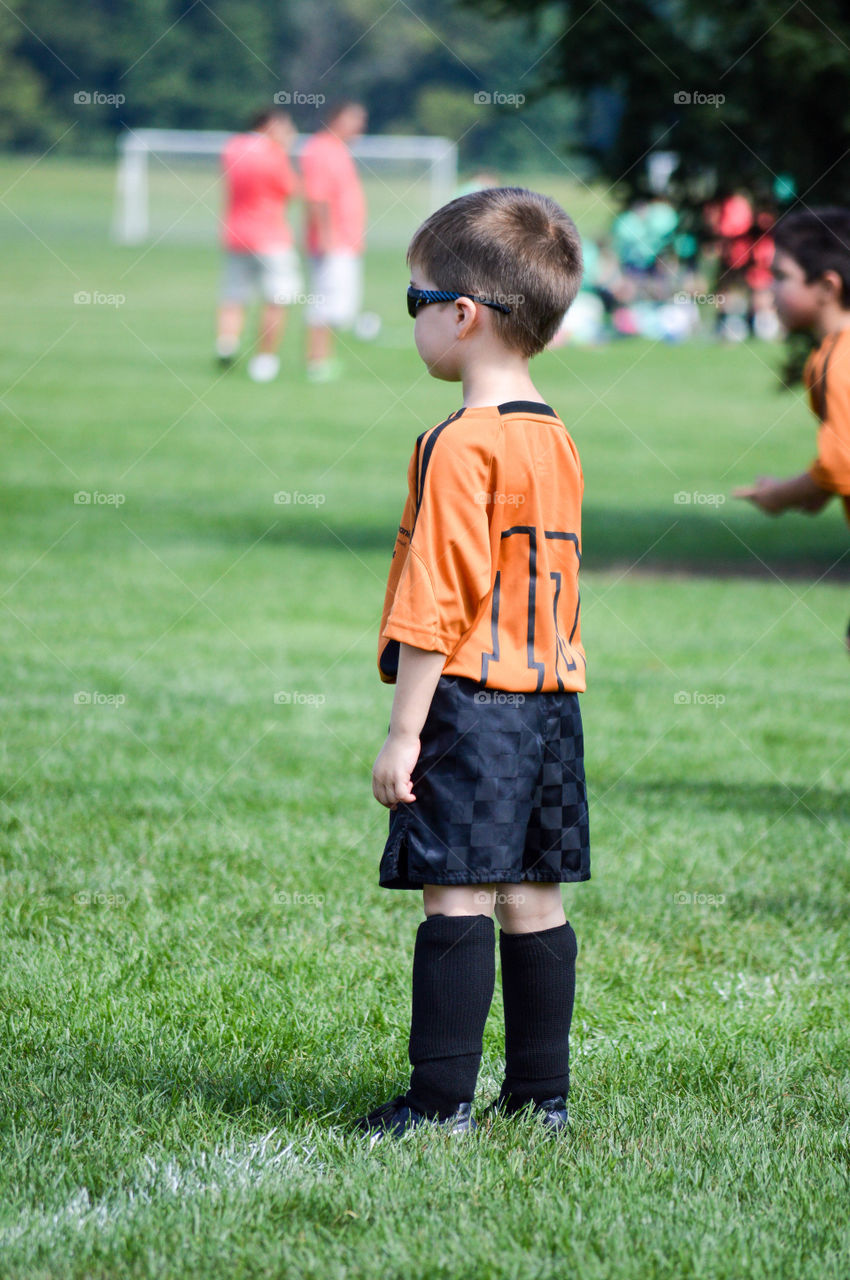 Young boy playing a soccer game