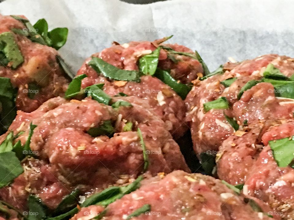 Spinach filled large Italian meatballs before cooking, 
