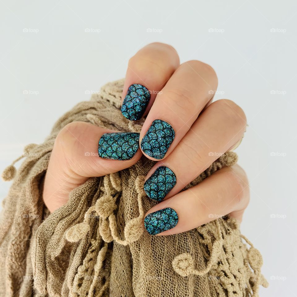Blue black mermaid manicure nail polish color Street. Layer Mermaid Brigade over any color to change its look. Underneath this mani is a black, deep red, and navy blue to give it a dark dramatic look.