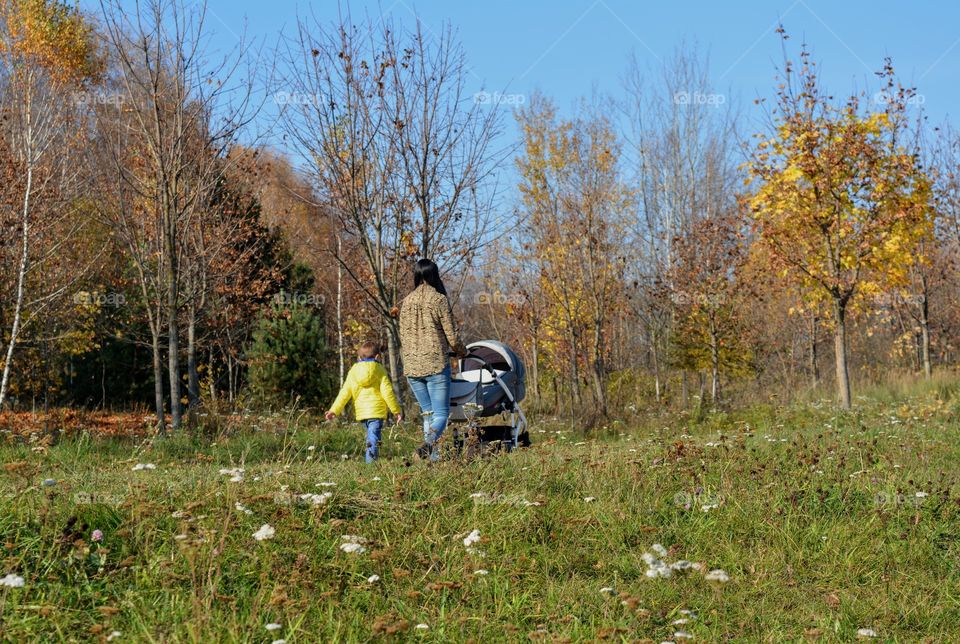 family walking outside, nature landscape, social distance