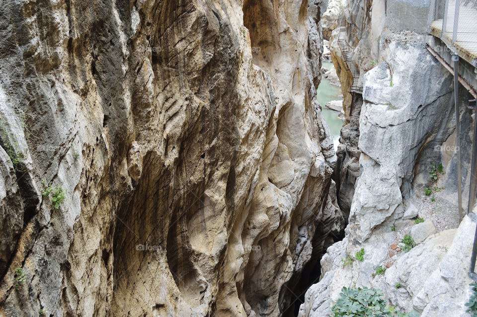 Caminito del Rey is a passage built on the walls of the Los Gaitanes gorge, between the municipalities of Ardales, Álora and Antequera, in the province of Málaga, autonomous community of Andalucía, Spain. It is a pedestrian walkway of more than 3 kilometers (in addition to 4.8 kilometers of access), attached to the rock inside a canyon, with sections of a width of just 1 meter, hanging up to 105 meters high above the river, in almost vertical walls