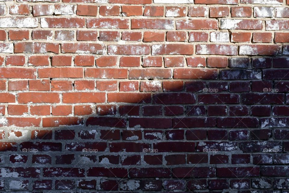 Photo of a stone wall, light and shadow 