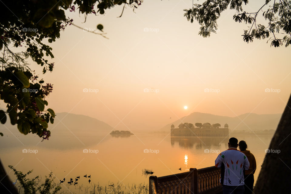 2 peoples standing at jal mahal ,jaipur,india view from jal mahal