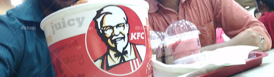 Tempting ,hot KFC. KFC bucket , smoky grilled chicken all spiced up. chicken wings with ketchup.too yummm