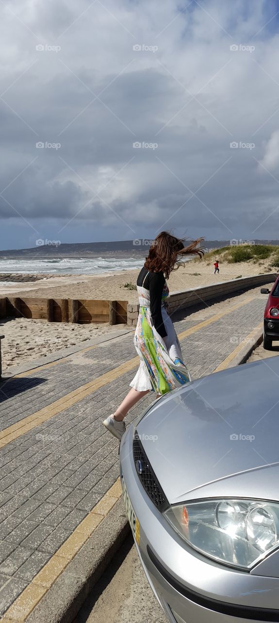 Going to the car after a walk along side the beach