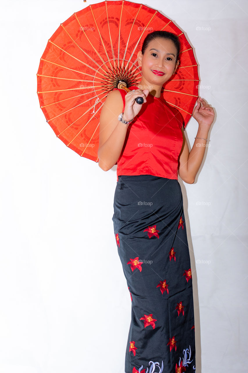 Asian lady with her orange paper umbrella