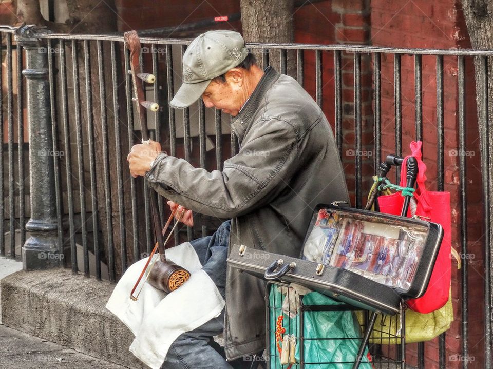 Street Musician Playing Traditional Chinese Lute. Traditional Chinese Musician
