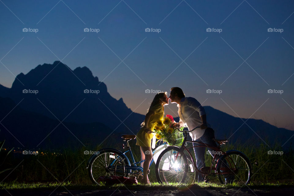 Yelow kiss. Girl in yellow dress kisses boy