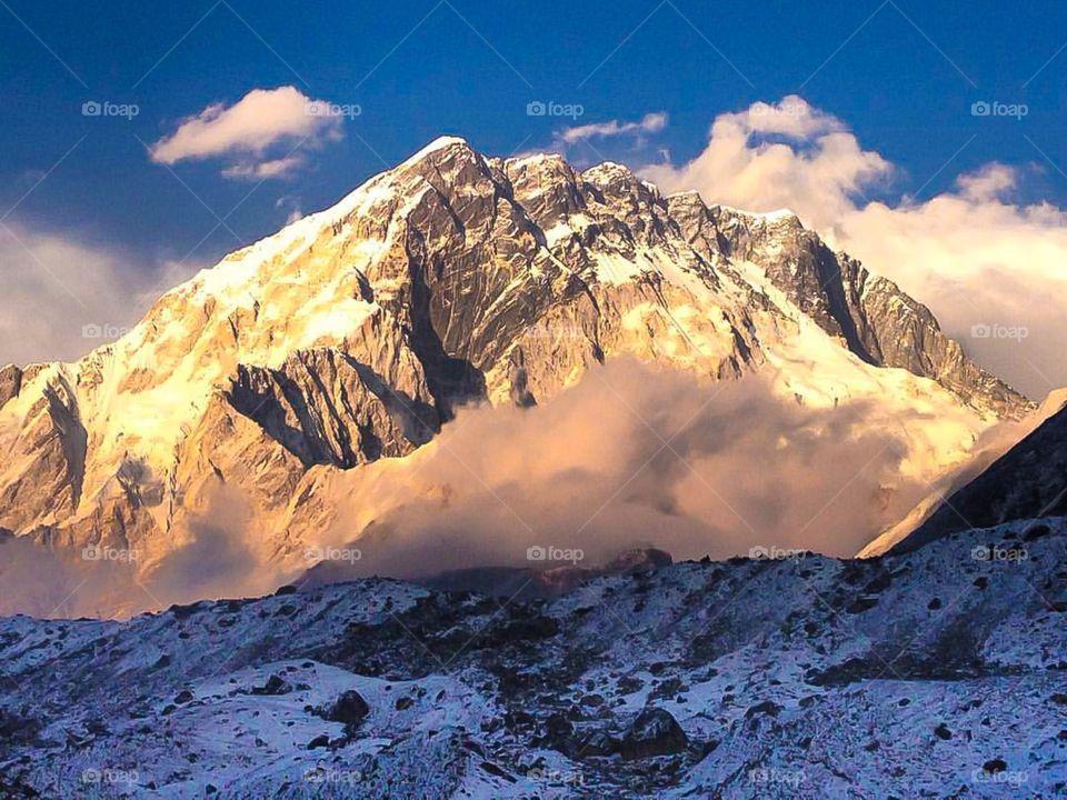 The sunset reflects off of the side of Mt. Nuptse on the way to Everest Base Camp. Photo taken from Lobuche, Nepal.