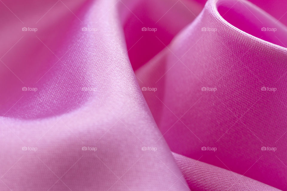 Satin Luxury Cloth Texture Can Use As Abstract Holidays. Abstract design background. Smooth Elegant Shiny Pink Silk