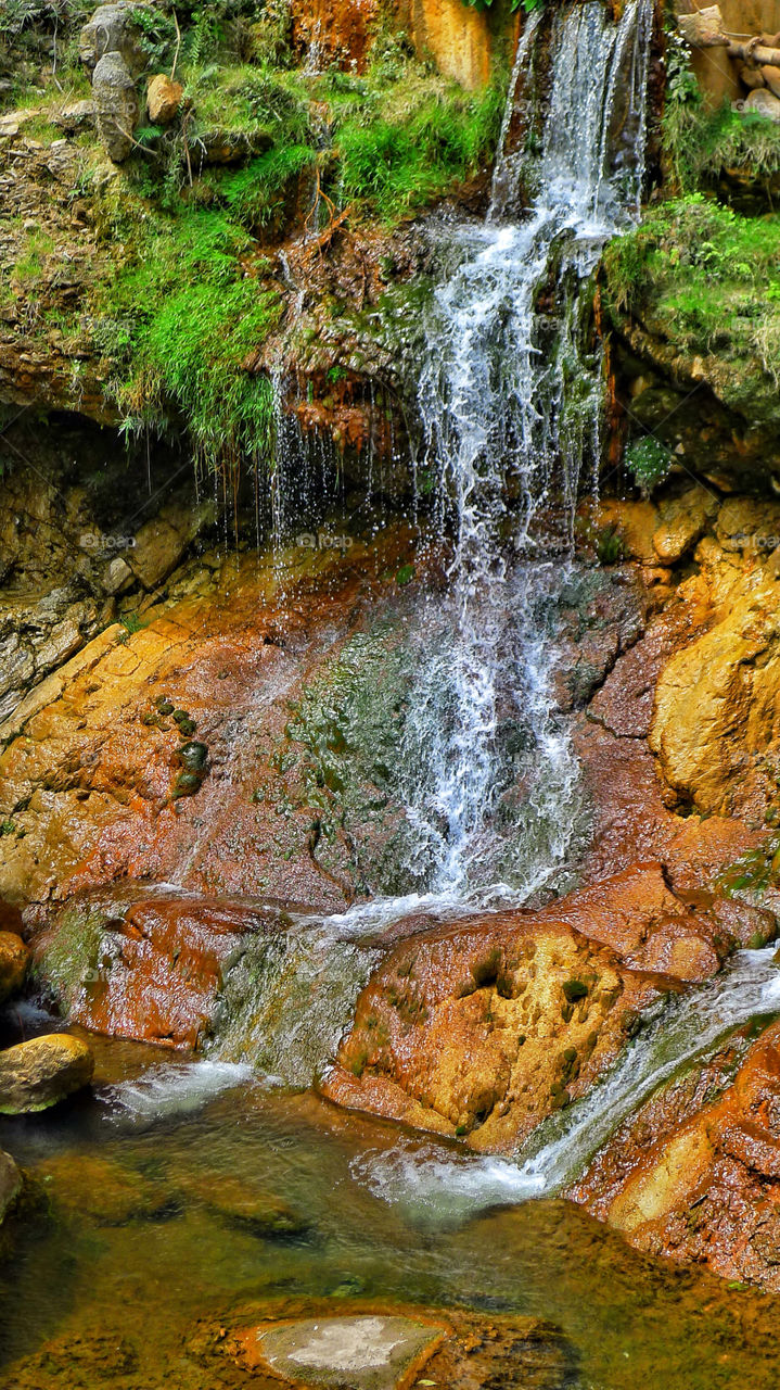 Small waterfall from a mining mountain