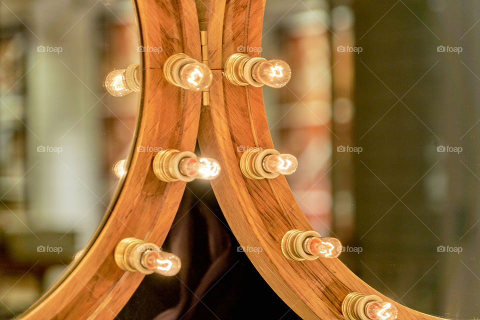 Close-up of lights on mirror