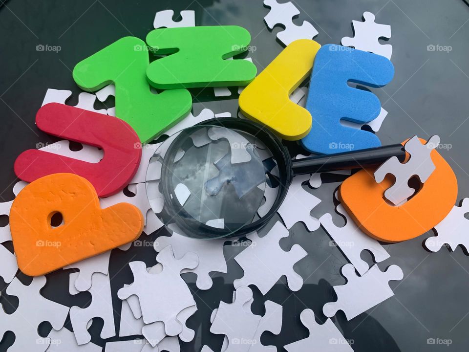 PUZZLED Word Kids Lettering With Magnified Puzzle