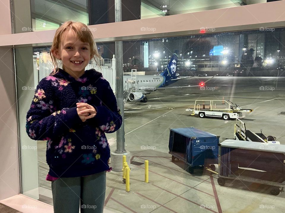 My brave little girl ready for her first flight on Alaska Airlines 