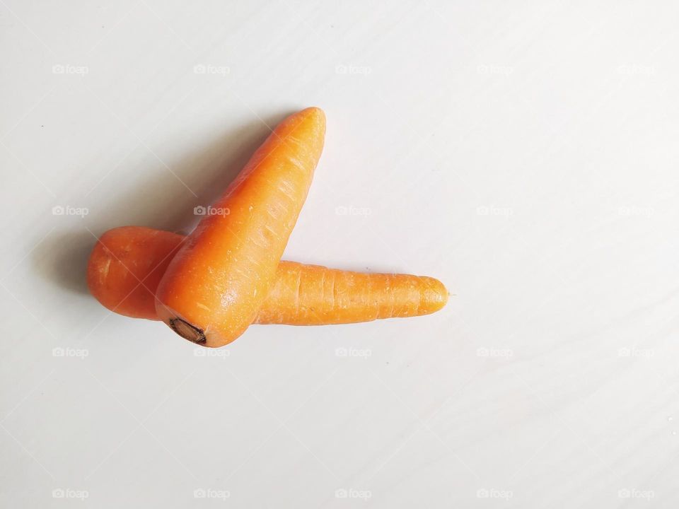 Two carrots isolated on white background