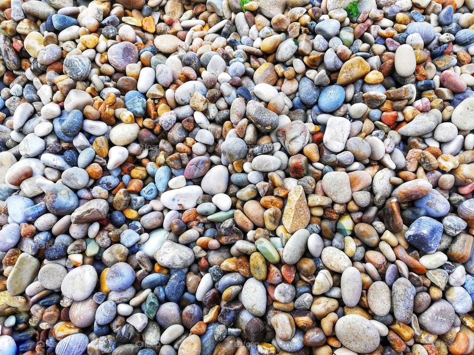 background with pebbles by the sea