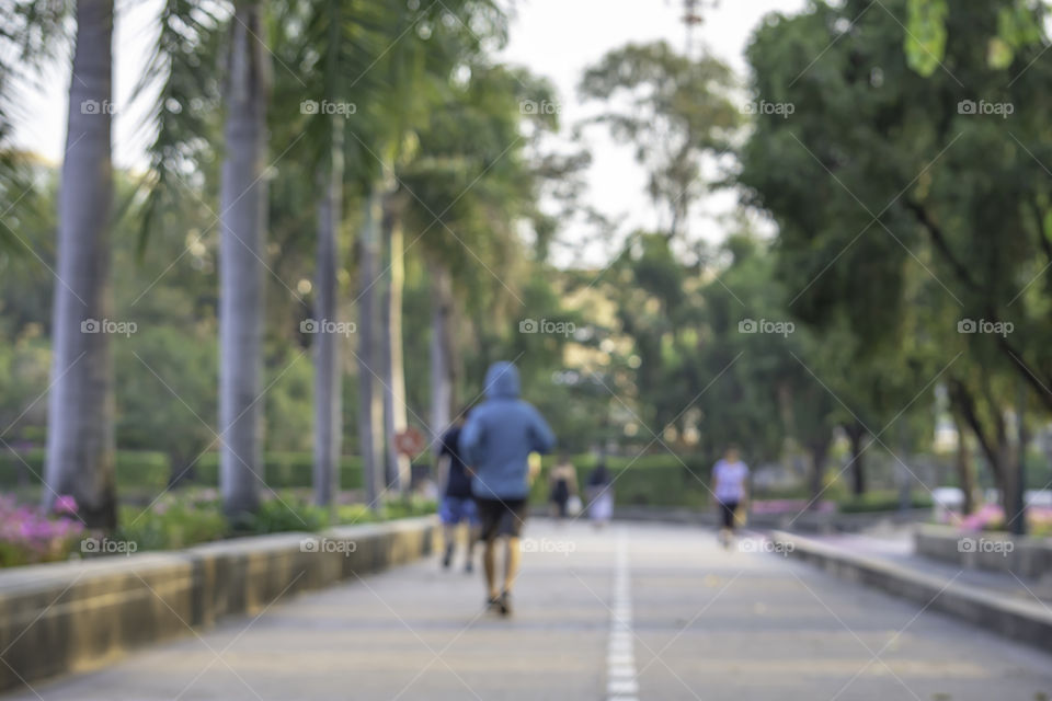 Blurry image people running exercise for health in the Benjakitti Park , Bangkok in Thailand.