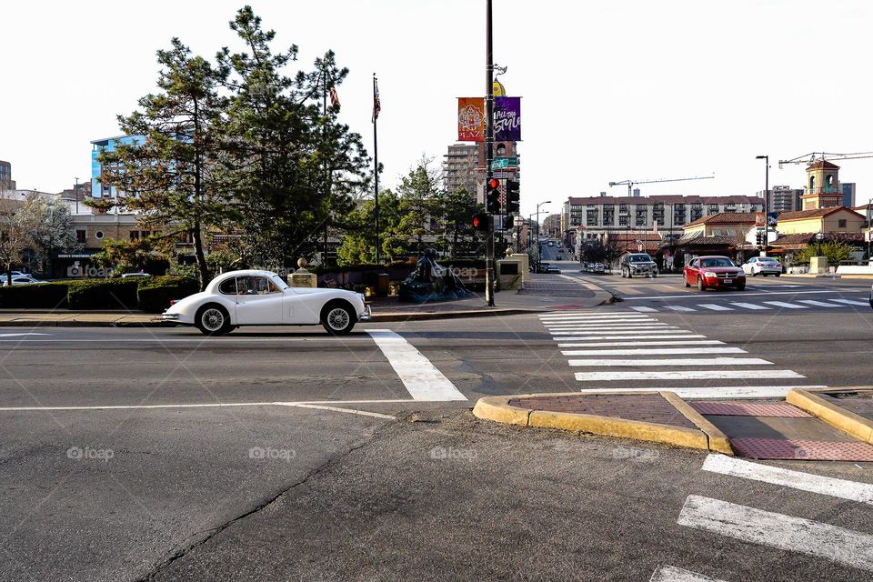 Old car at a stop light