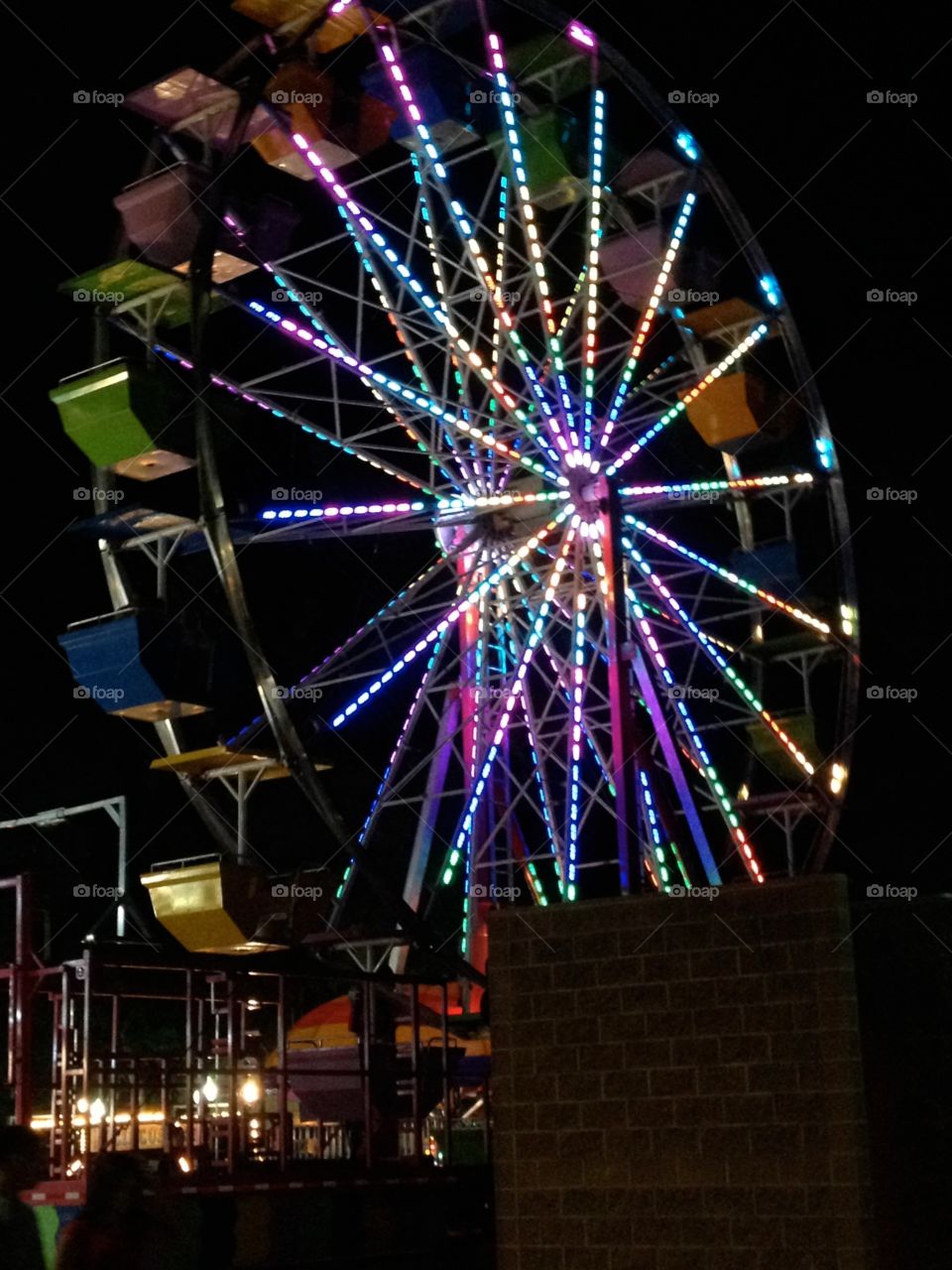 State fair. Neon Ferris wheel 