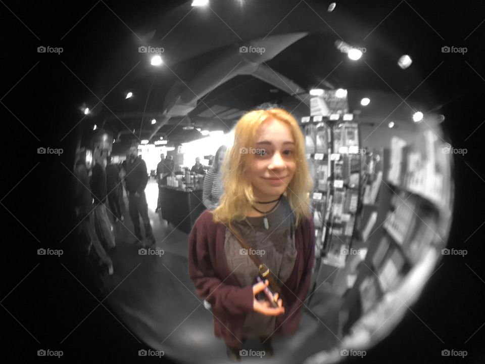 Smiling woman seen from door hole