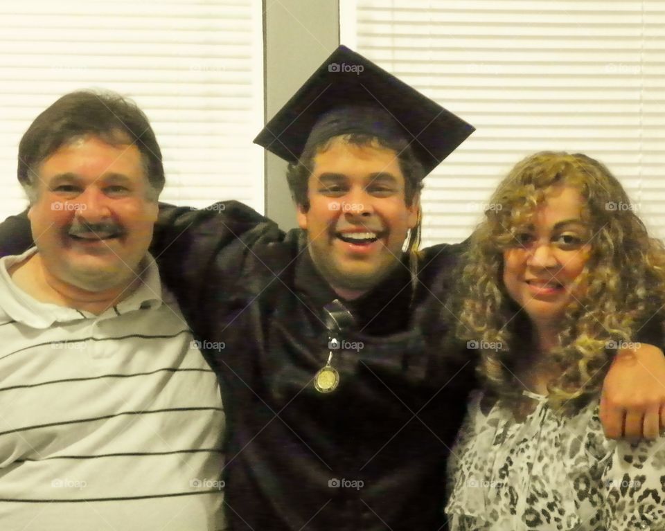 Portrait of Graduate man with his parent
