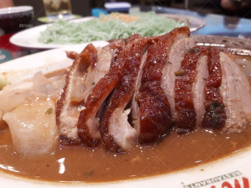 The roasted duck poured with bean sauce